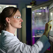 Scientist operates the laboratory robot for metal and element analysis in foodstuffs